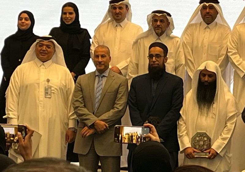 With fellow award recipients at the Qatar University convocation, September 2026